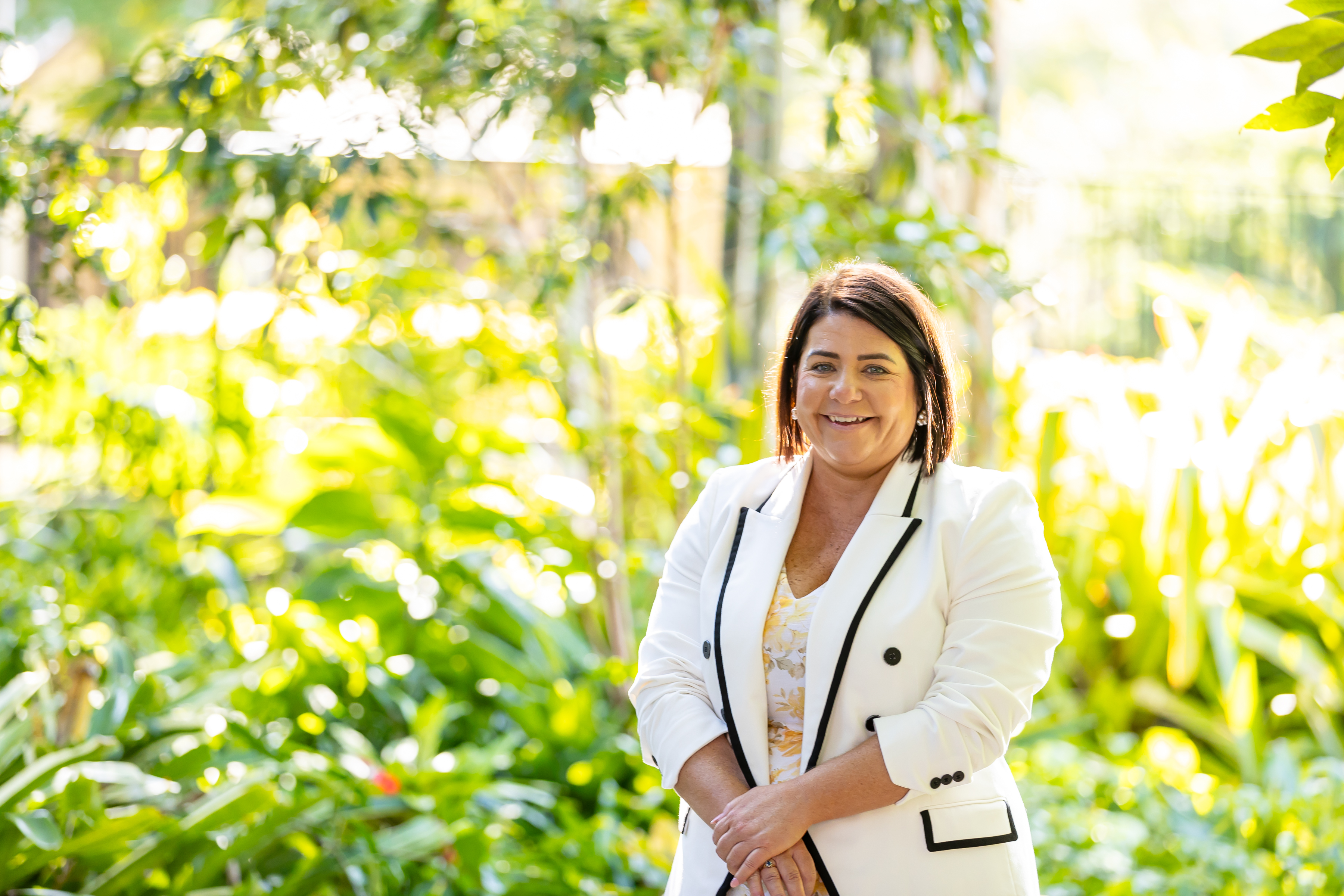 Bec O’Connor, Principal, standing outdoors on school grounds, representing school leadership, approachability and connection with the St Peter Chanel School community
