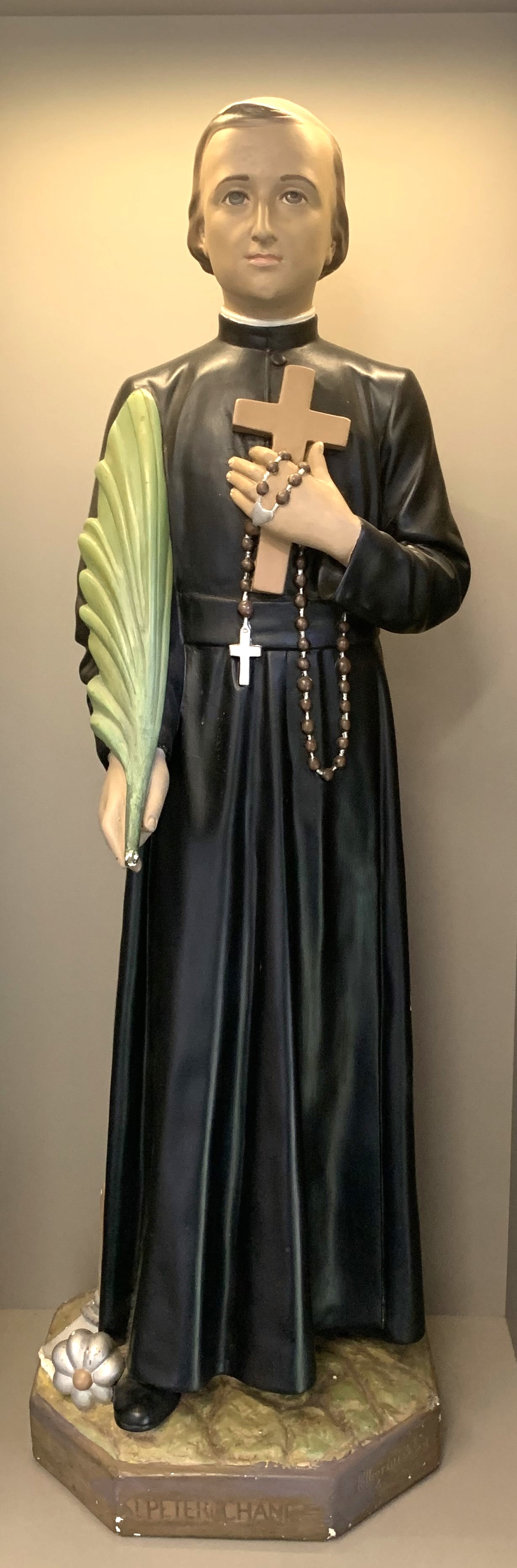 Statue of Saint Peter Chanel holding a cross and palm, representing faith, sacrifice and the spiritual patronage guiding the St Peter Chanel school community